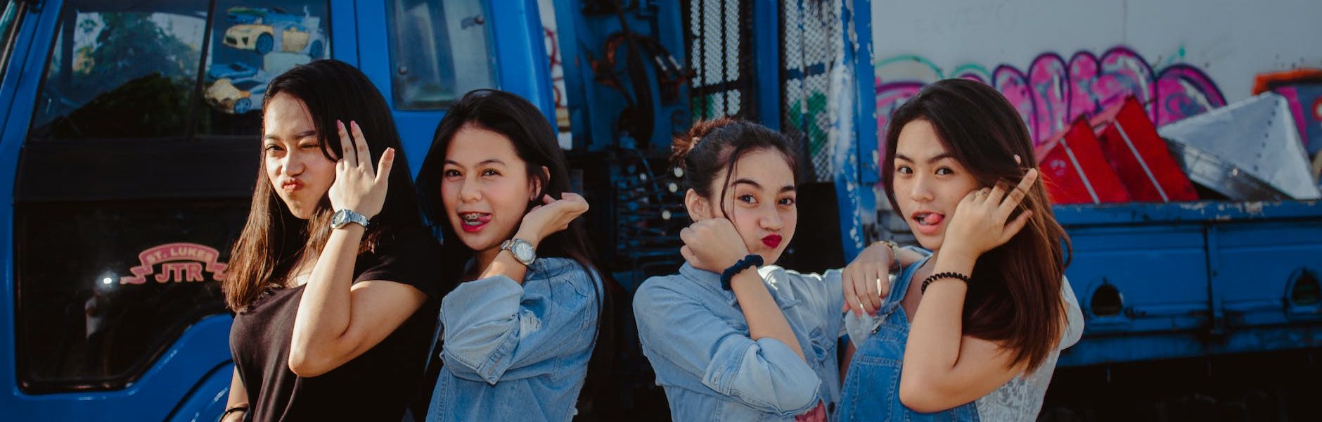 Group of teenage girls making silly faces.