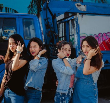 Group of teenage girls making silly faces.