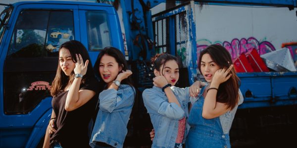 Group of teenage girls making silly faces.